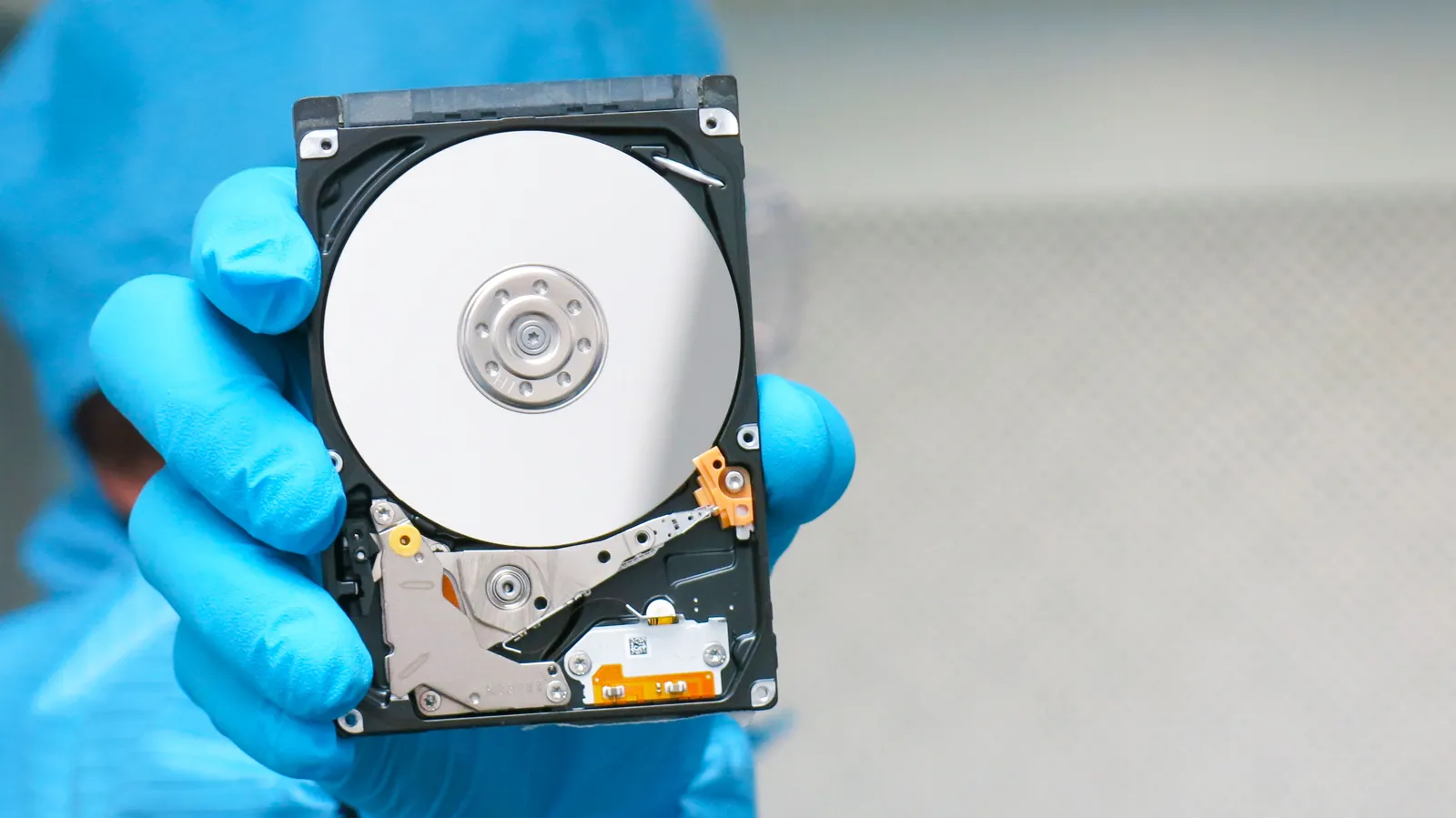 Open hard drive with exposed platters in the cleanroom